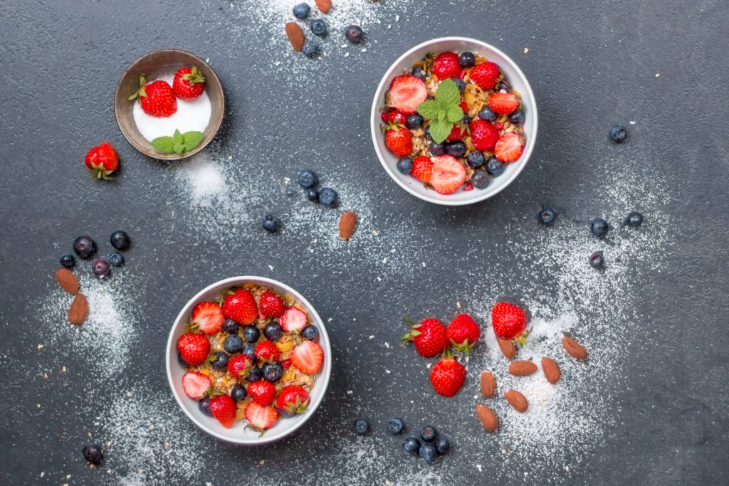 Bowls with blueberries and strawberries